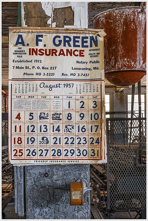 August 1957 Calendar Near Fire Bucket