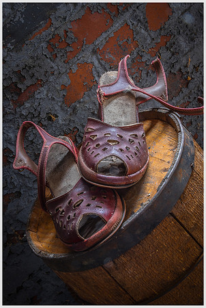Old Woman's Shoes on a Barrel