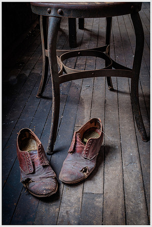 Torn Shoes Near Stool